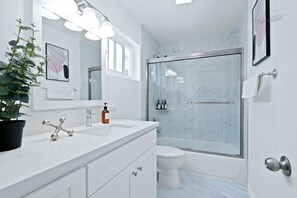 Hair dryer, towels, soap, shampoo