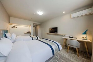 A hotel room with two beds, a desk, a chair, a TV, and a hanging light fixture. - Wanfenglin Hotel (Shanghai Heqing Meijiayi Plaza Branch) (Shanghai)