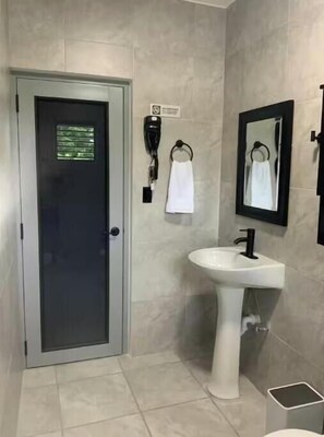 Shower, hair dryer, towels, shampoo