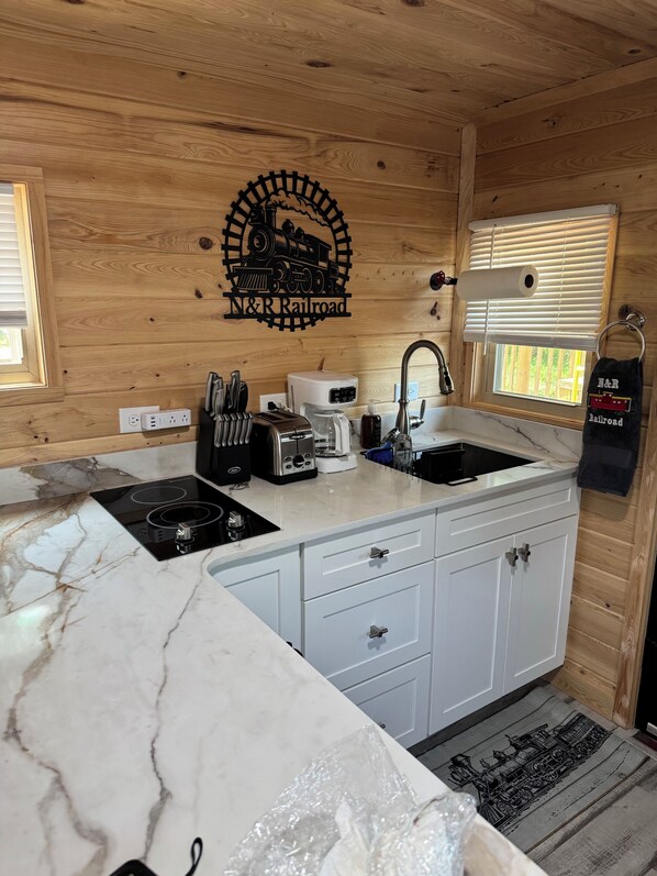 Fridge, microwave, stovetop, coffee/tea maker