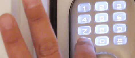 A close-up of a keypad with illuminated numbers and symbols, including a call button and a '#' key.