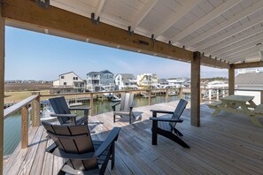 Outdoor dining - Hobbs Realty - Waterfront living at The Minnow, a charming 2 bedroom with a day dock! (Holden Beach)