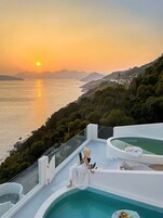 Seasonal outdoor pool, open 6:00 AM to 9:00 PM, pool umbrellas