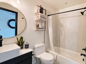 Shower, hair dryer, towels, soap