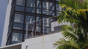 A modern building with a glass facade and a metal framework. - Brand New 2 Bed Seaview Apartment Utopia Karon (karon)