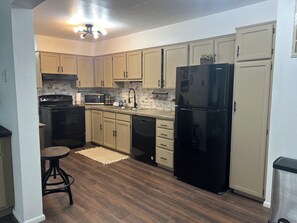 Fridge, microwave, oven, stovetop - Cozy Condo on 400 N (Logan)