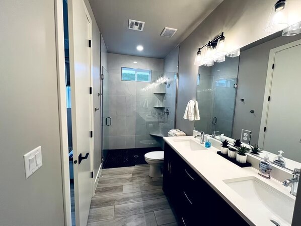 Shower, hair dryer, towels, soap