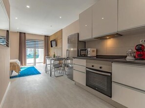 Fridge, coffee/tea maker, toaster, cookware/dishes/utensils