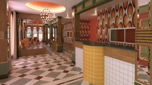 A hotel lobby with a check-in counter, patterned walls, and a checkered floor. - Happy Live Quest Hotel  (Bangkok)