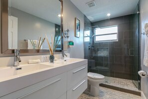 Shower, hair dryer, towels, shampoo