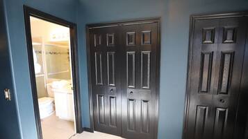 Shower, hair dryer, towels, shampoo