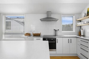 Fridge, microwave, oven, stovetop - Lake Front Oasis | Across from the Lake with Deck, Courtyard & Space to Relax (Taupō)