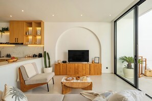 Junior Villa, Balcony, Pool View | Living area