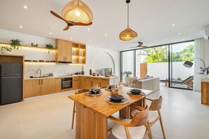 Junior Villa, Balcony, Pool View | Dining room
