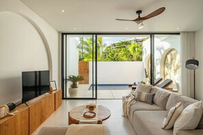 Junior Villa, Balcony, Pool View | Living area | Flat-screen TV