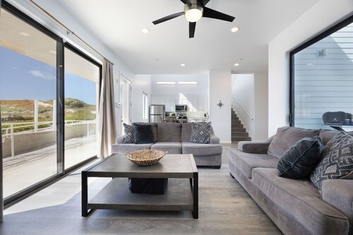 Oceanfront 2BR + Rooftop Deck, & Beach Access | Strand Way B