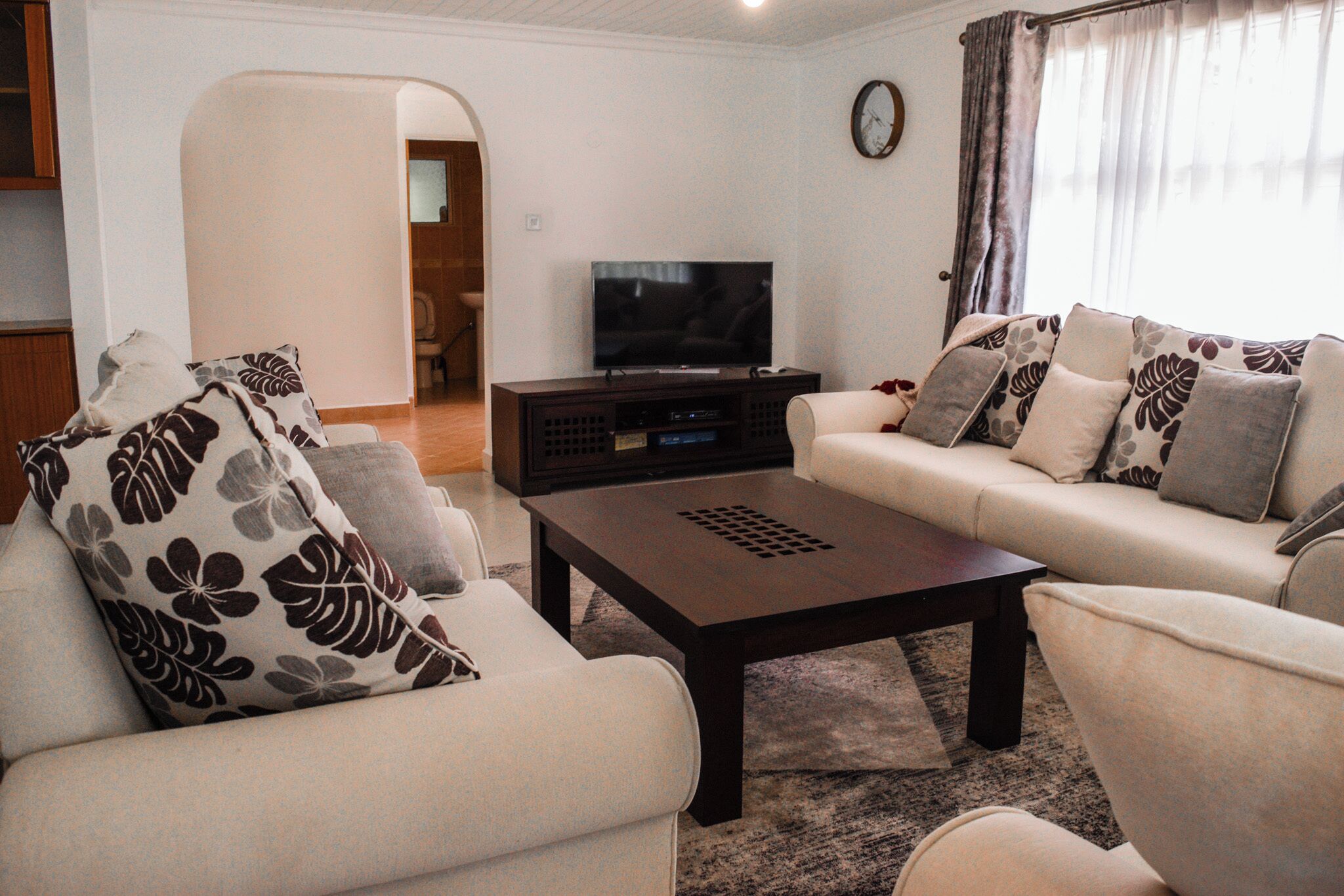 Comfort Villa | Living area | 55-inch Smart TV with cable channels