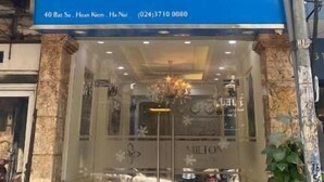 The exterior of the Milton Boutique Hotel with a blue facade and a glass entrance. - Hanoi Milton Boutique Hotel  (Hanoi)