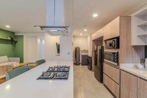 Fridge, microwave, stovetop, coffee/tea maker