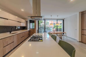 Fridge, microwave, stovetop, coffee/tea maker