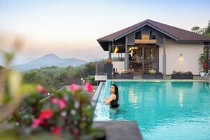 Outdoor pool, open 8:00 AM to 6:00 PM, pool umbrellas, sun loungers