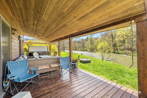 Riverside retreat with hot tub, scenic views, rustic charm & open-plan luxury – perfect escape!