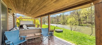 Riverside retreat with hot tub, scenic views, rustic charm & open-plan luxury – perfect escape!