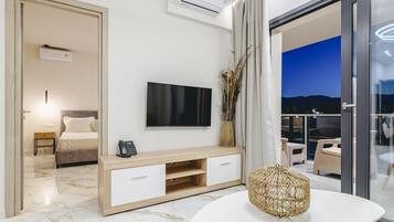Suite, 2 Bedrooms | Living area | 50-inch flat-screen TV with cable channels