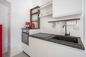 Fridge, stovetop, coffee/tea maker, cookware/dishes/utensils