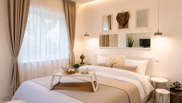 A modern bedroom with a bed, bedside tables, a bedside lamp, a window with curtains, and a wall-mounted mirror. - Metropole Apartments Romana Square (Bucharest)