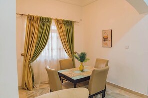 Economy Apartment, Balcony, City View | Dining room