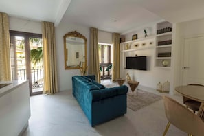 Deluxe Apartment, Balcony, City View | Living area | TV