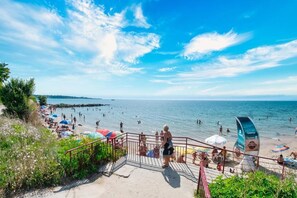 Guests can enjoy access to the beach from the property, with a lifeguard tower nearby for added safety.
