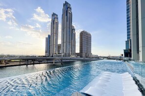 A swimming pool with a view of high-rise buildings in the background. - SIMPLY COMFORT Missoni Top Floor with Sea, Canal and Burj Khalifa Views (Dubai)