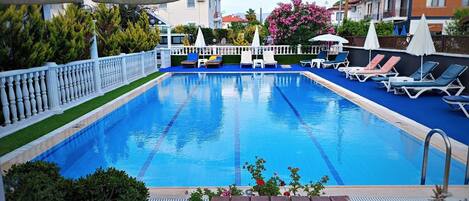 Seasonal outdoor pool, open 9:00 AM to 9:00 PM, free cabanas