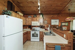 Microwave, dishwasher, coffee/tea maker, cookware/dishes/utensils