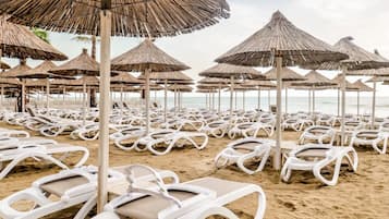 Beach nearby, white sand, sun loungers, beach umbrellas