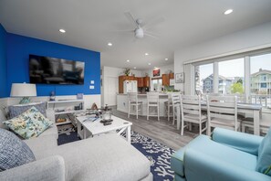 Smart TV, mesa de pingue-pongue, livros