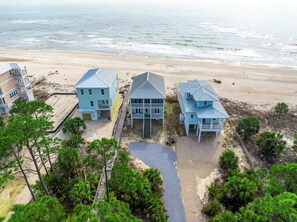 A beachfront property with three houses, a wooden walkway, and a beach view. - 🌴Stunning Beachfront Views-Sandpiper🌴 (Indian Pass)