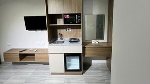 A modern kitchen with built-in appliances, a countertop, and a built-in oven.
