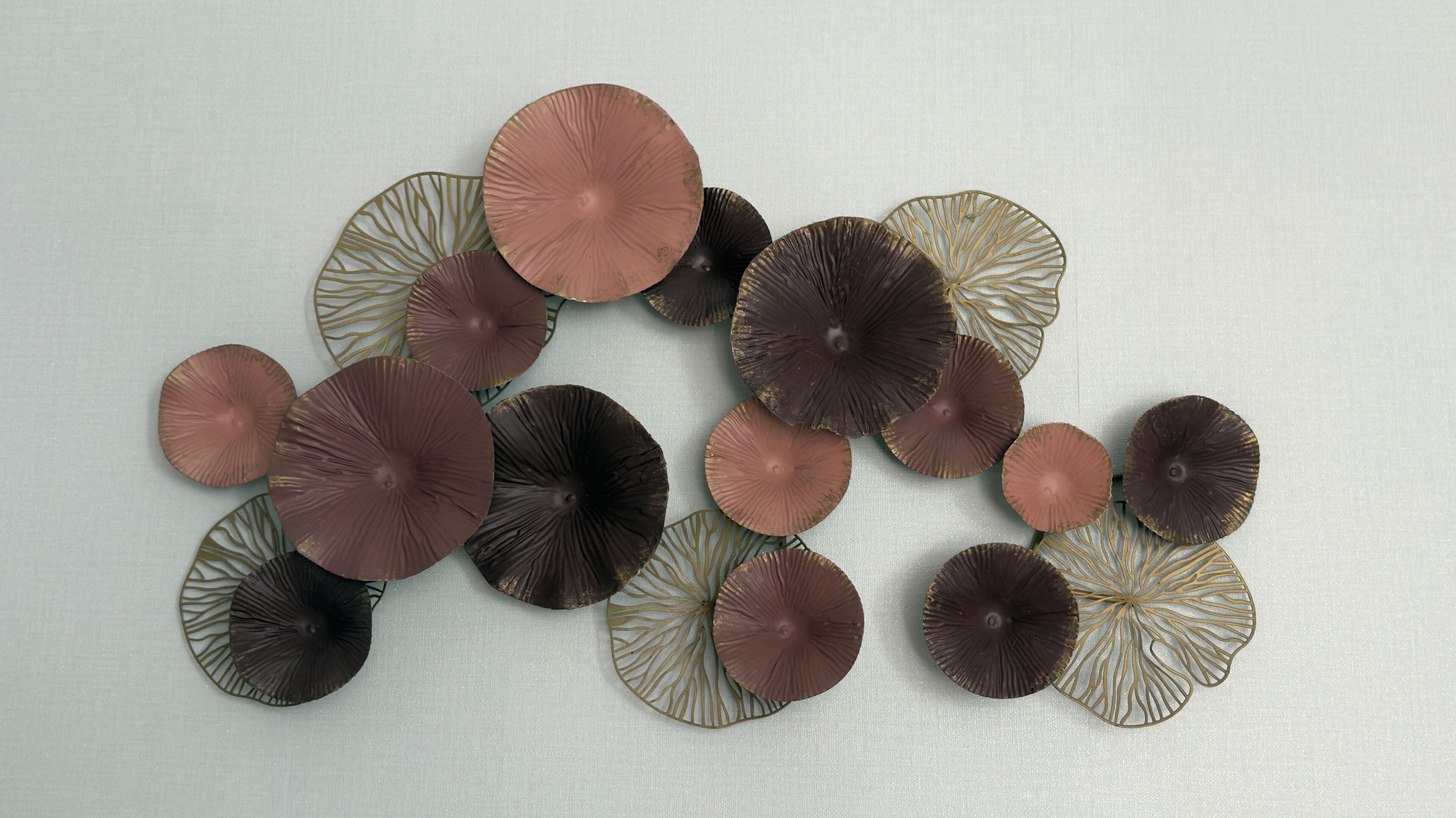 A collection of circular objects with a ribbed texture and a central dark spot, arranged on a light-colored surface.