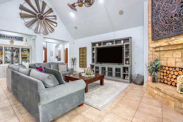 Bright living area with ample seating and Smart TV