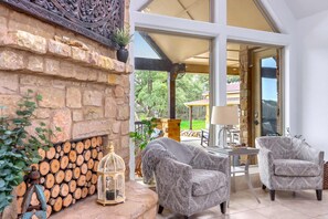 Bright living area with ample seating and Smart TV