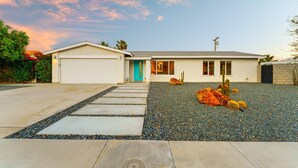 A single-story house with a garage, a front door, and a small patio area with cacti. - 30% Off September Perfect 4 Families Pool, Jacuzzi (Palm Springs)