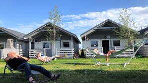 A residential area with two houses, each with a balcony and a small porch. - Holiday Home Dziwnówek near Baltic Sea (Dziwnówek)