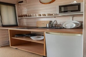 Fridge, microwave, stovetop, coffee/tea maker