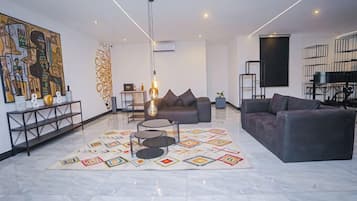 Economy Apartment, Balcony, City View | Living area | Flat-screen TV