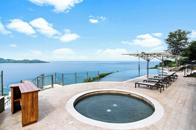Luxury Condo with Panoramic Ocean Views, Sparkling Infinity Pool, and Modern Open-Concept Design