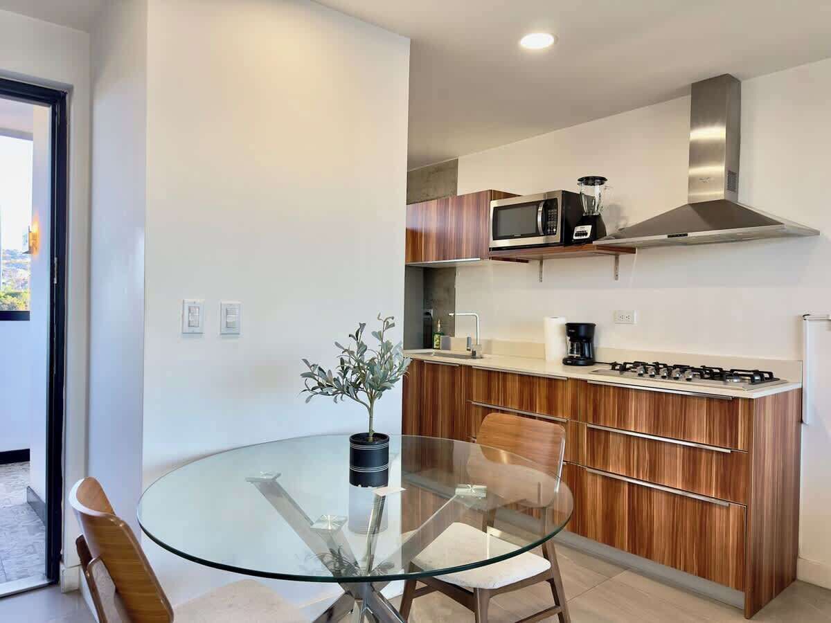 Fridge, microwave, stovetop, coffee/tea maker
