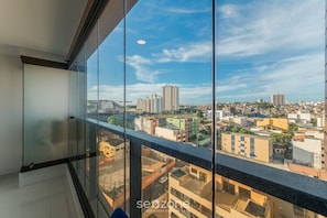 A high-rise building with a view of a cityscape through large windows. - SMT - Building 750m From the Beach in Salvador (Salvador)